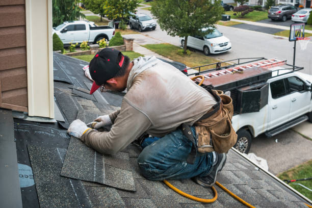 Professional Roof Replacement technician working in Etna, NY